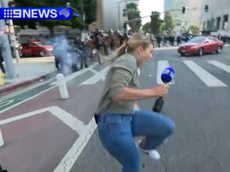 Protesters clashing with law enforcement officers in Los Angeles USA.